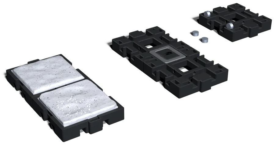 Two tiles snapped together with their floors in, two more on their backs with a clip across the seam, and one on its back with magnets going into the holes near its corners